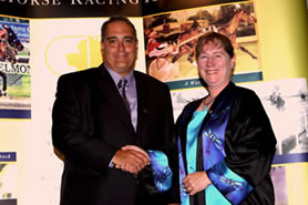 Gayle Ecker congratulating Joe Muscara Jr. at the Hoseracing Hall of Fame