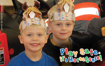 Two boys with 'horse' hats