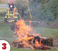 firefihjyer containing a burning hay bale